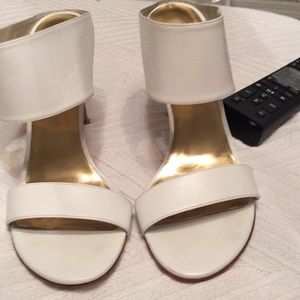 Stuart Weitzman. Creamy white slide on heels.